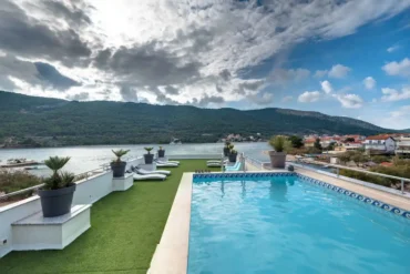 Roof swimming pool with sea view at Holidays Roko in Grebaštica